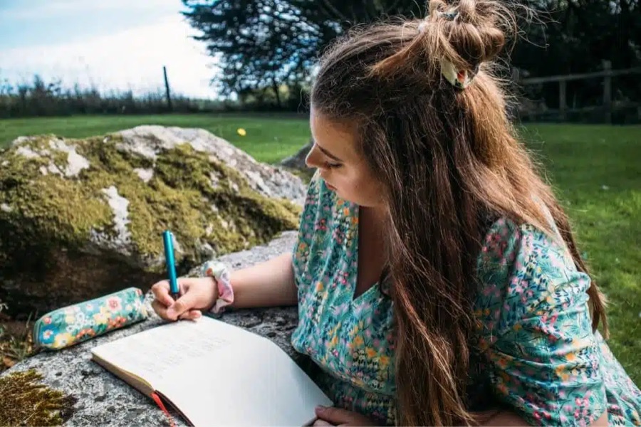 Rachel Shillcock writing in her notebook